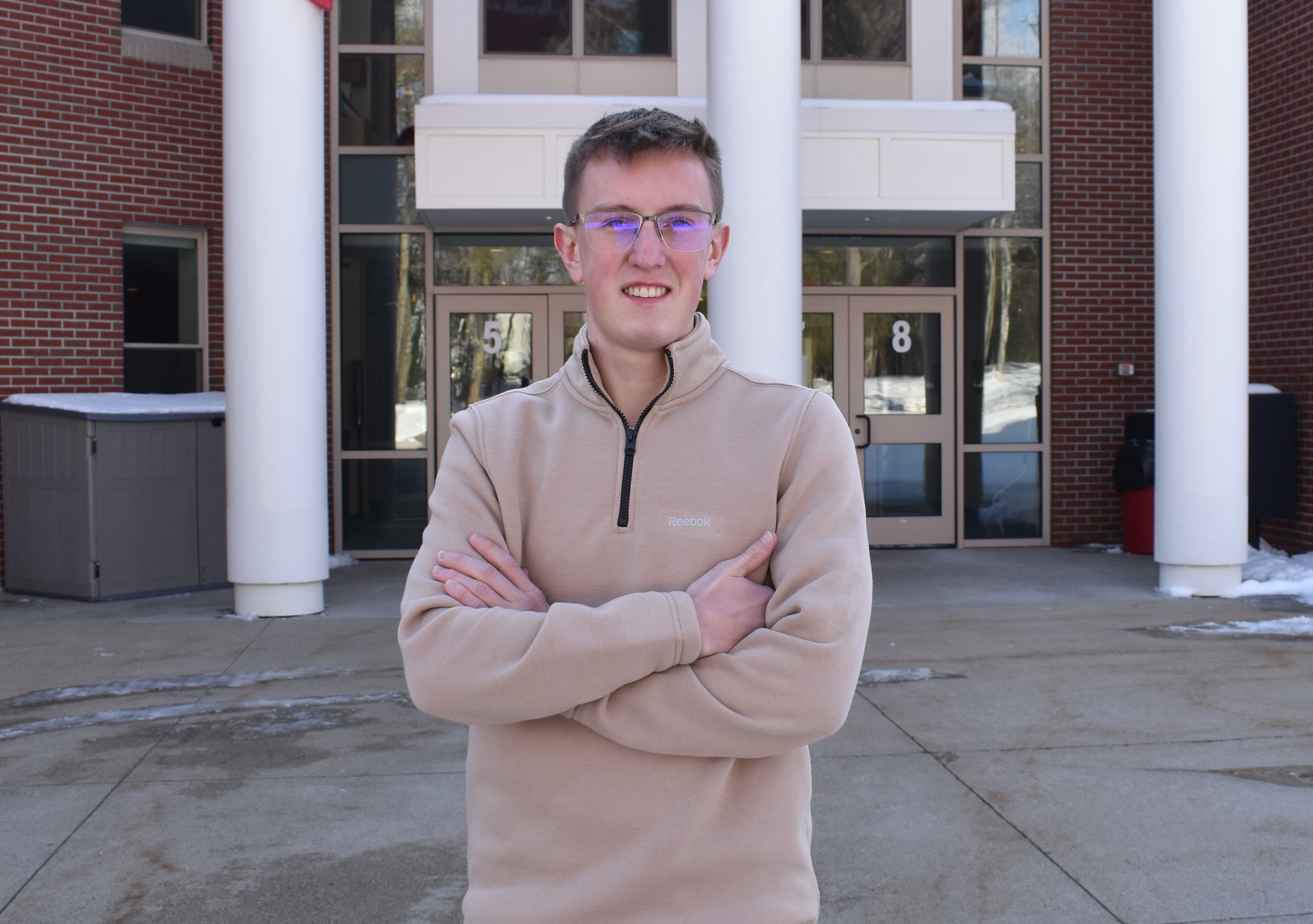Gabriel Hatfield outside the entrance to Wells High School in January 2026 
